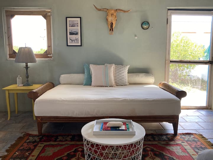 Comfortable living room futon (full) for lounging and sleeping.