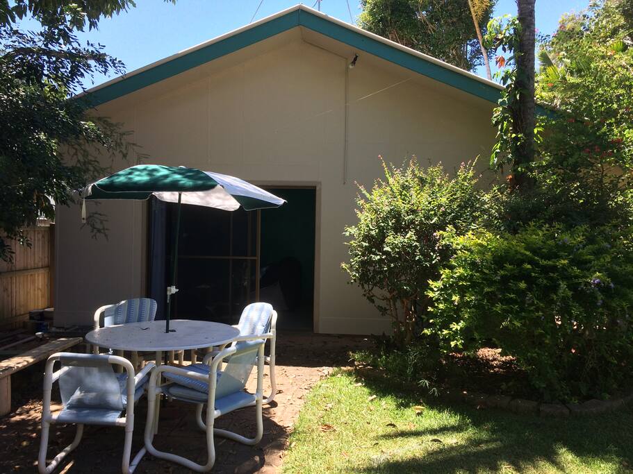 Outside dining table, chairs & umbrella outside fully screened sliding doors to your private, detached studio apartment