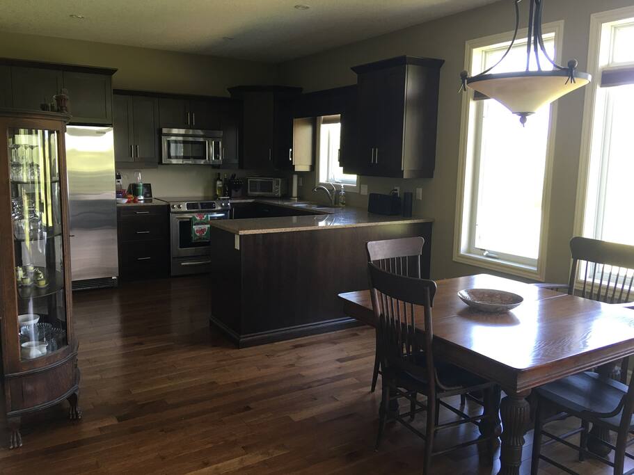 The large open concept Kitchen with granite counter-tops