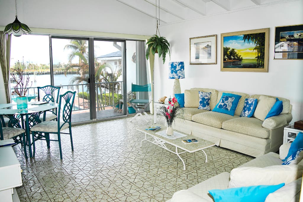 The living room is spacious and opens onto the balcony