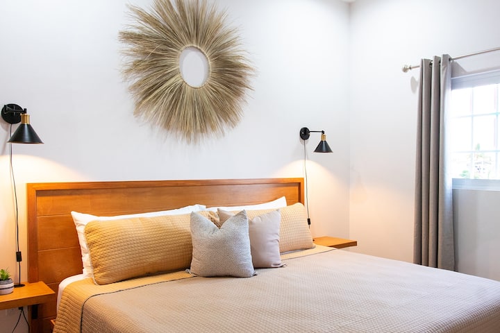 Master bedroom with KING bed SiZE Equipped with a screen, one ton mini split, and ceiling fan.