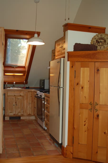 Galley kitchen, lots of natural light.