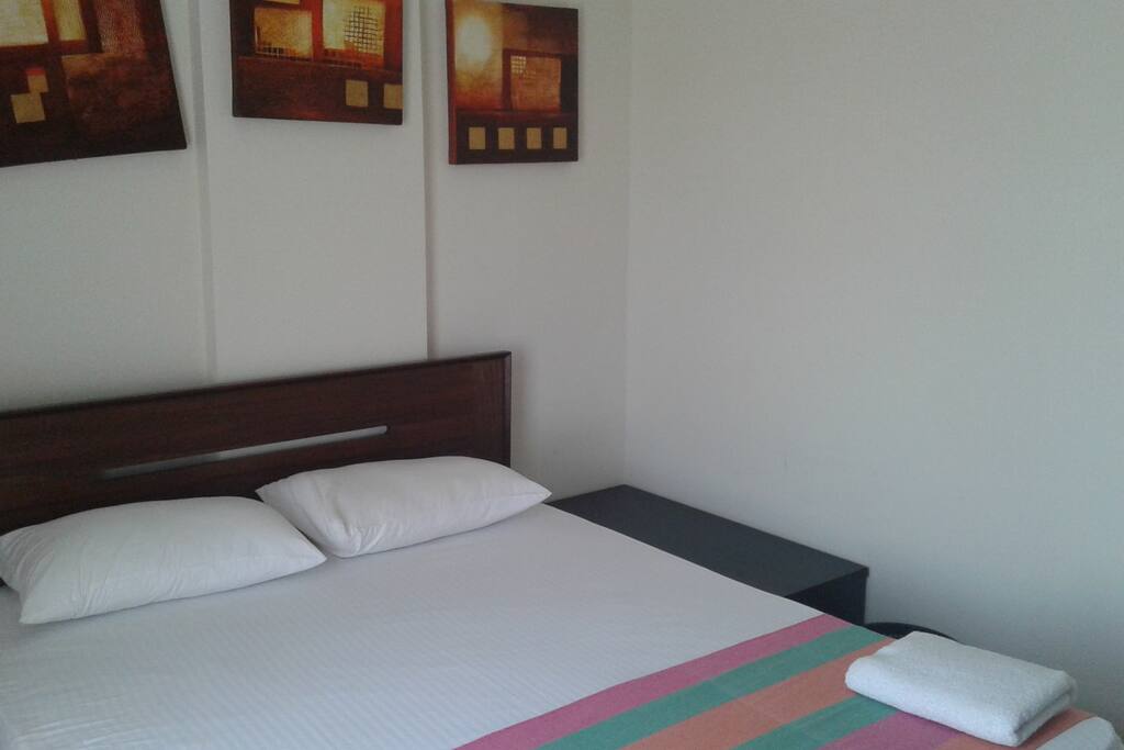 double bed with white linen