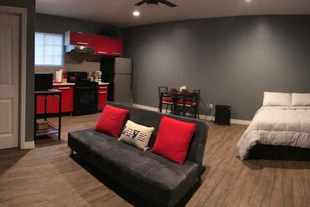 Red, clean, and modern studio apartment
