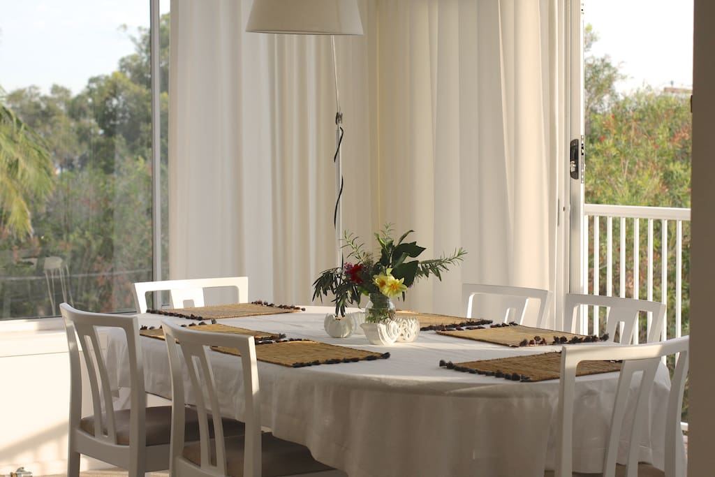 Sunfilled Dining area with table for 6 guests