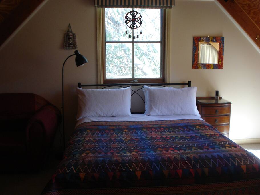 Loft bedroom includes single sofa bed lounge