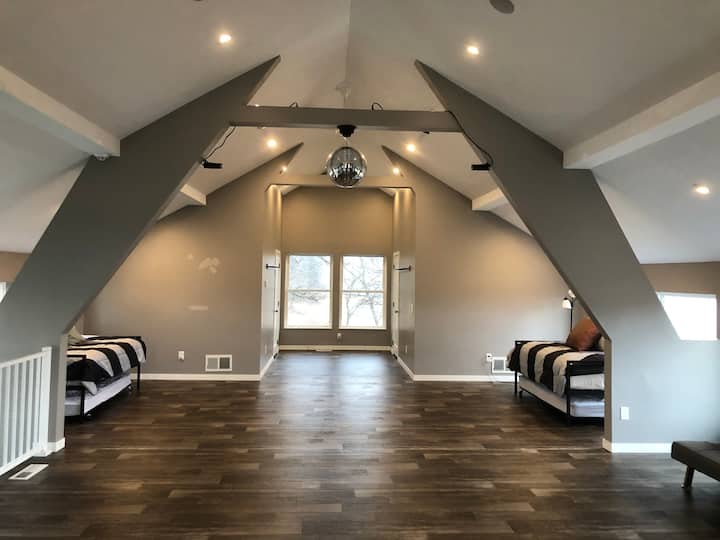 The yoga loft or old hay loft has four twin beds in a trundle style.  There is a working disco ball if you want to have a dance party!
