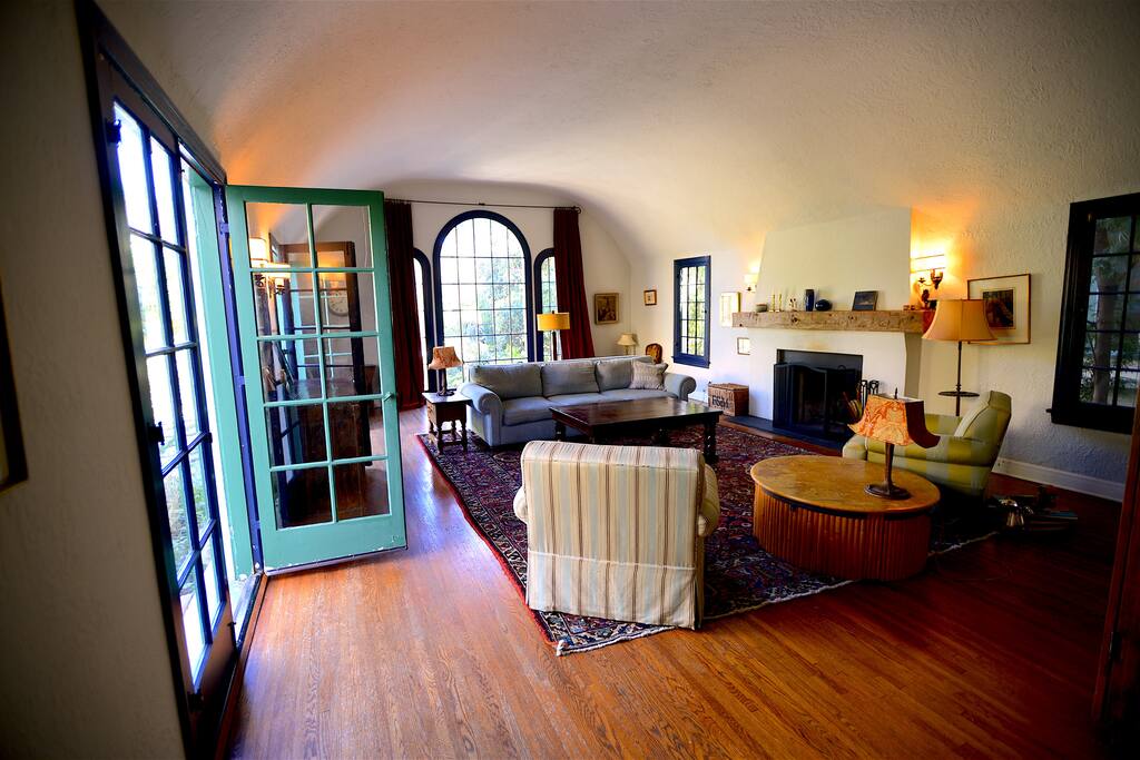 Living room with 15ft high vaulted ceiling, TV and games cabinet