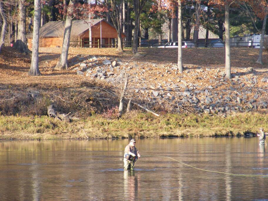 Wade-in fly fishing in the Little Red River just outside the front door of the cabin