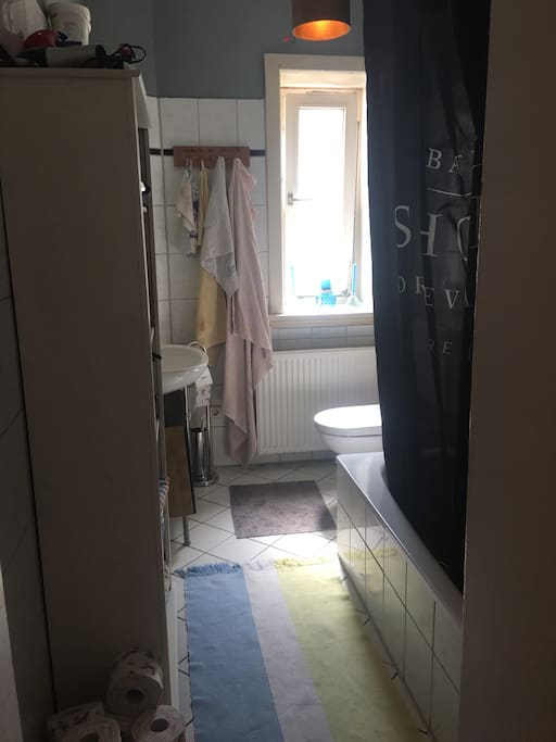 Bathroom with shower and bathtub