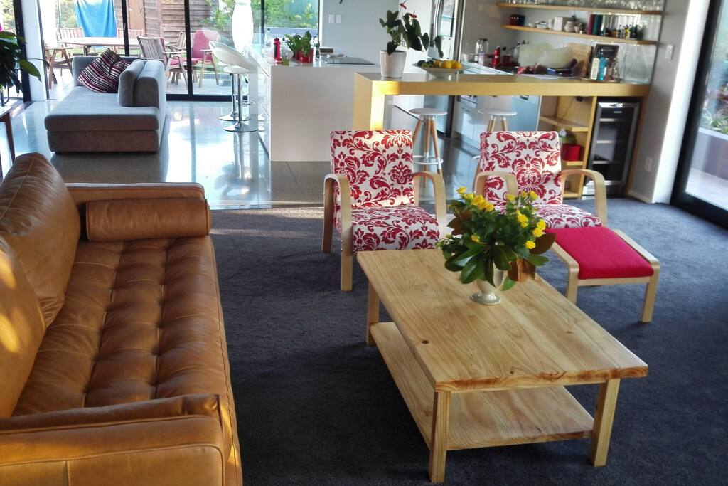 Large comfortable lounge with open plan kitchen