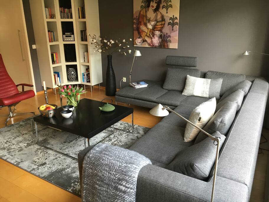 Spacious and sunny living room with relax chair.