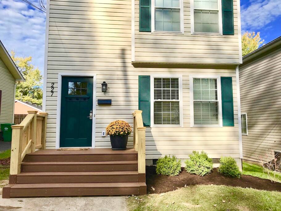 Front porch with new landscaping. Off street parking in driveway.