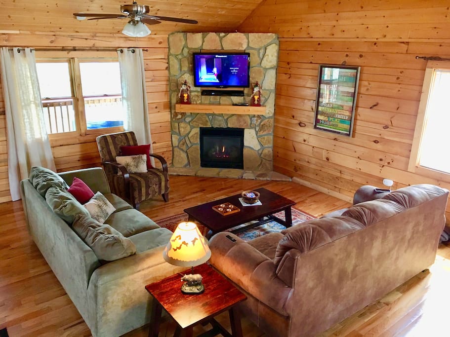 Comfortable living room with gas fire place and queen pull-out sofa bed