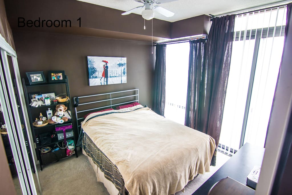 Master bedroom & exit to balcony.