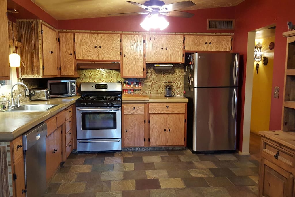 Spacious kitchen includes concrete counter tops, gas range and stainless appliances. A toaster and coffee maker are available as well.