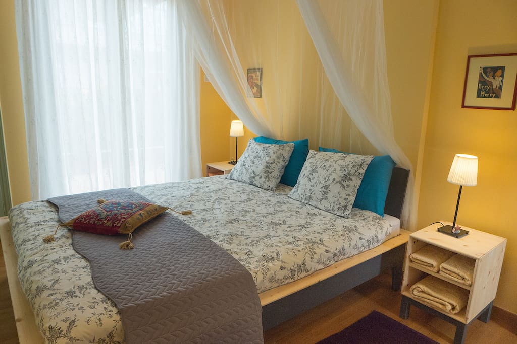 Sunny and cheerful bedroom with double bed, mosquito net, large wardrobe, fresh sheets and towels.