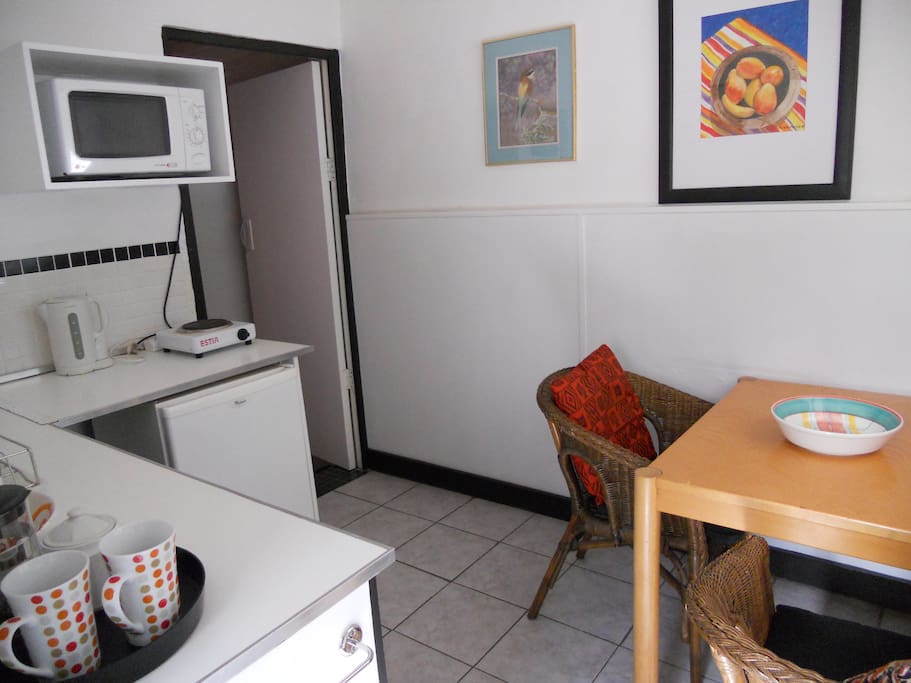 Kitchen with gas hob, fridge & table