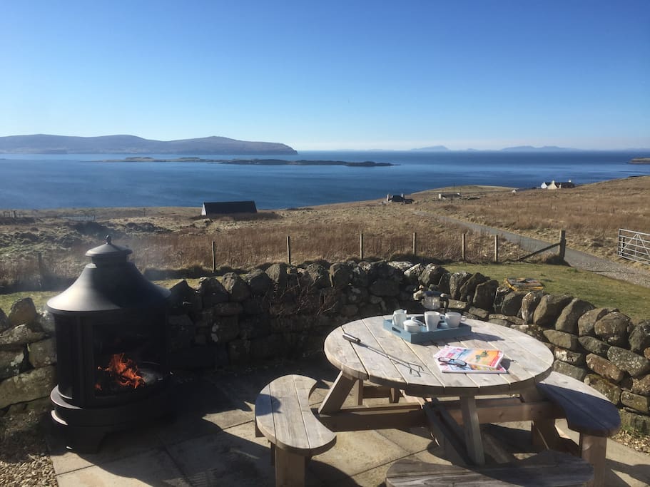 View from cottage with outside barbecue and dining area