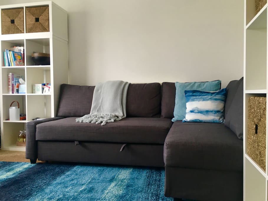 Lounge area with large sofa bed