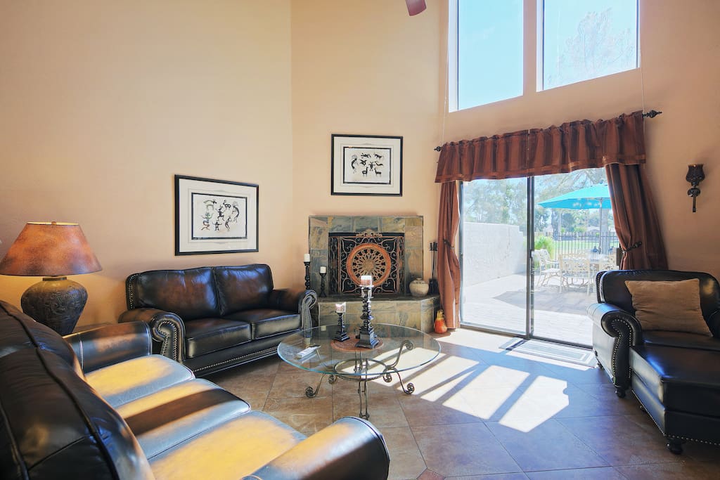 Access to the first floor patio, with views of the golf course, extends the indoor living room outdoors.