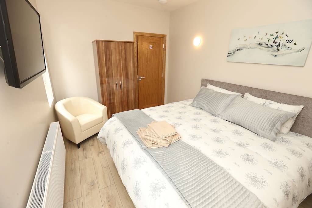 Bedroom 2 adjusted to set 2 guests, 1 x luxurious king double bed with wall mounted TV