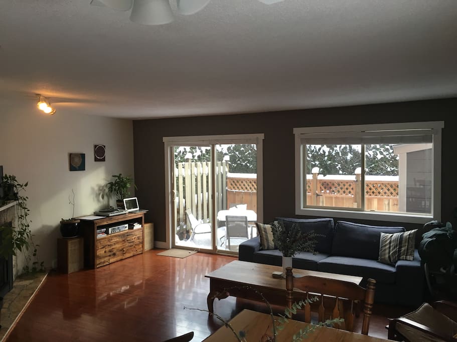 Living room with gas fireplace and access to private outdoor patio.