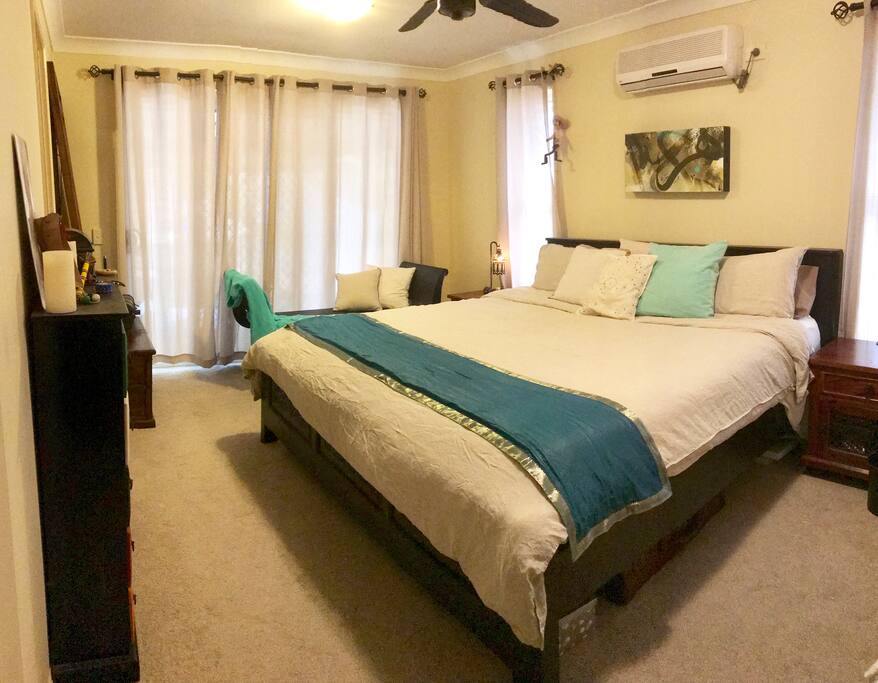 Large master bedroom with super king bed, ensuite with shower and walk in wardrobe. Opens up to landscaped garden.