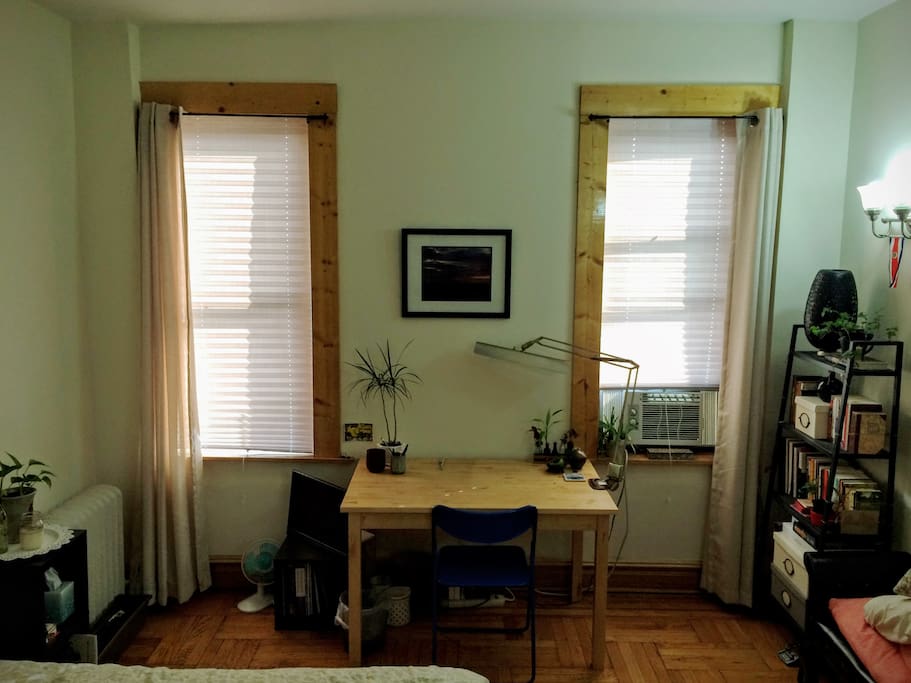 Nice big desk for working, and there's a tv (with chromecast) hiding under there, to watch from bed.