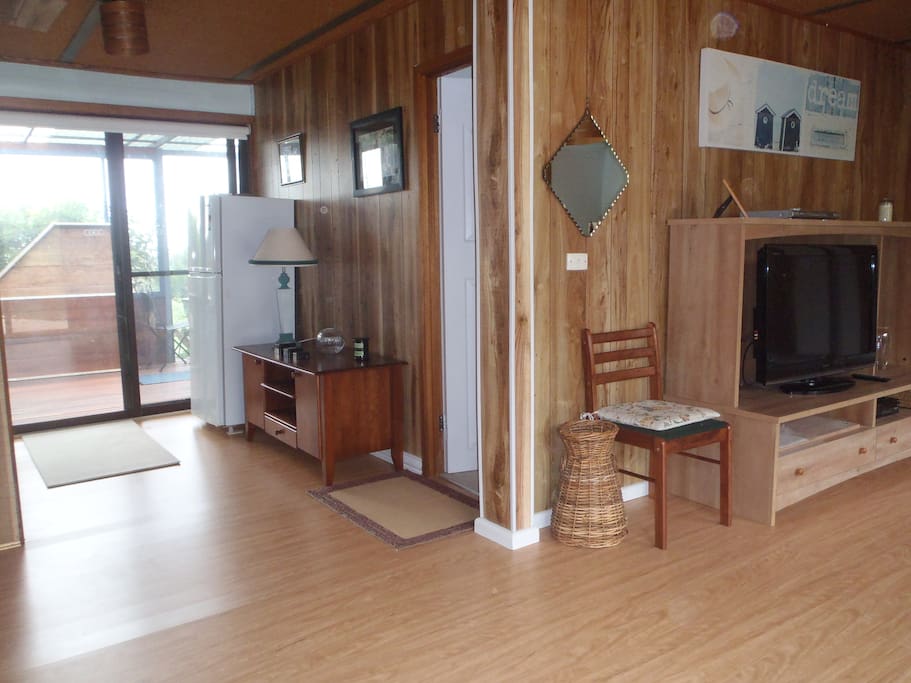 Guest lounge showing door out to guest decking