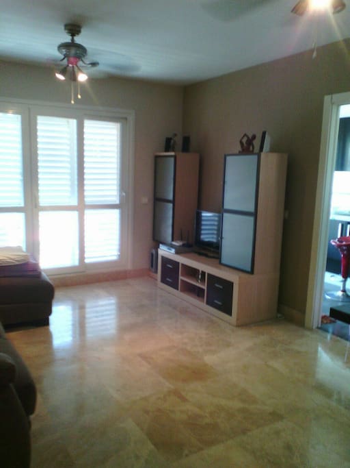 Open plan lounge and dining room with French doors to the terrace