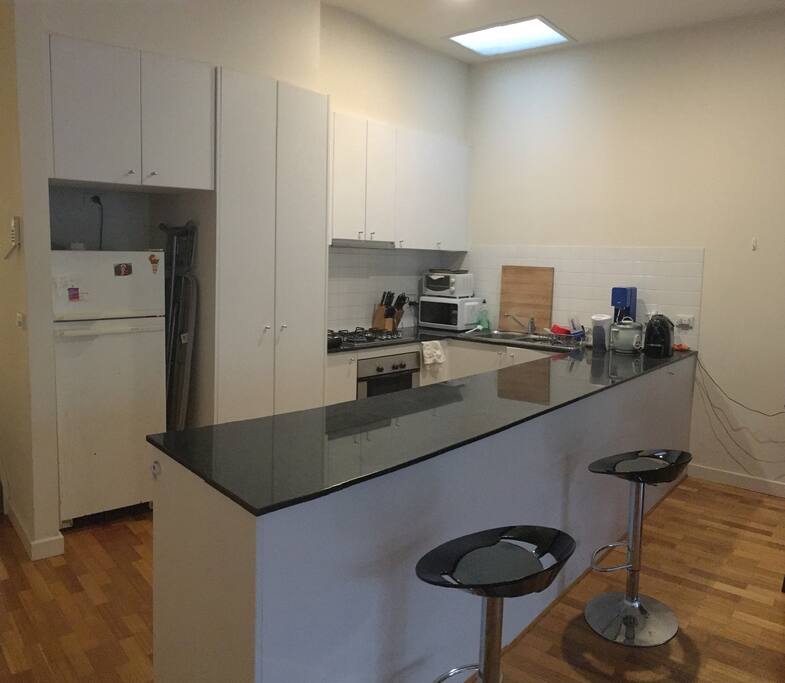 Kitchen – Modern with stone counters, European wood cabinetry, Frigidaire kitchen appliances. Includes dishwasher, garbage disposal, microwave, oven, coffee machine, toaster oven, electric kettle and all the cookware necessary to make a gourmet meal.