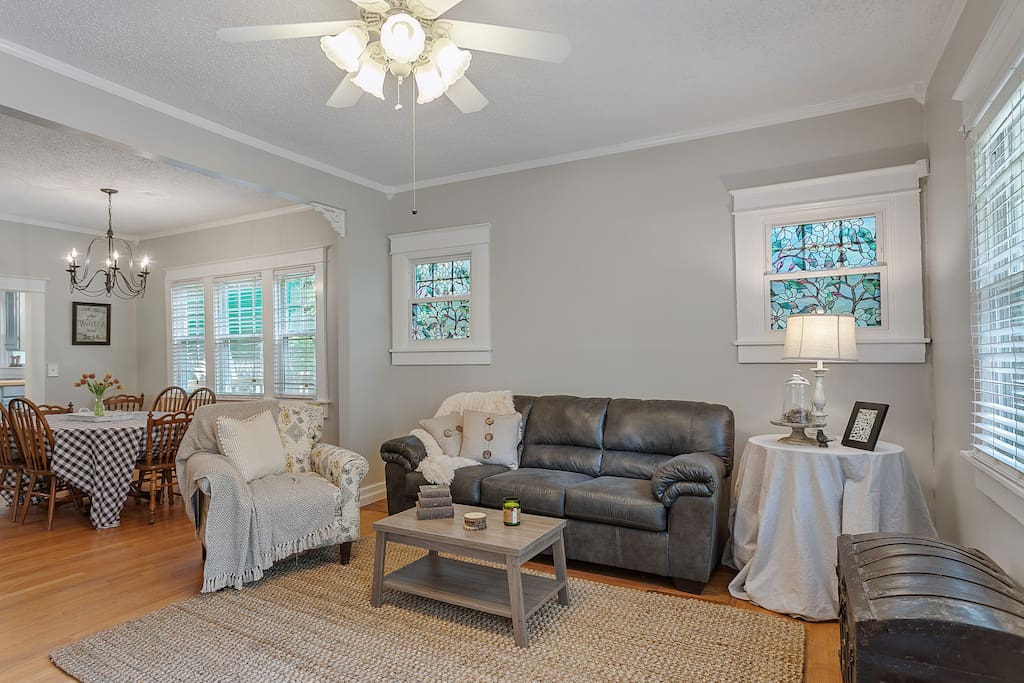 Open layout living room/dining room with plenty of seating to relax, play games or watch a movie