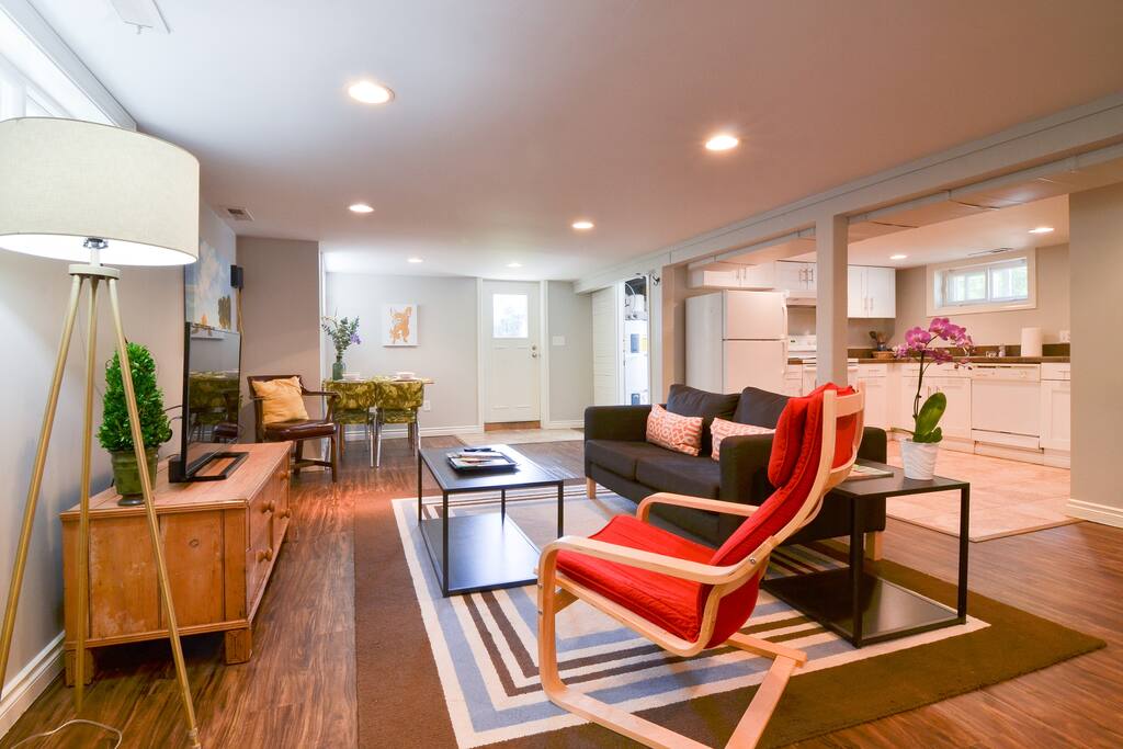 Large downstairs living room full of bright light.