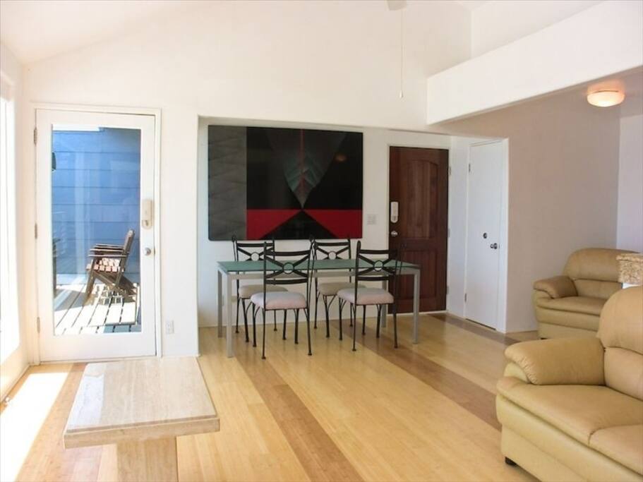 Hardwood floors, open dining area.