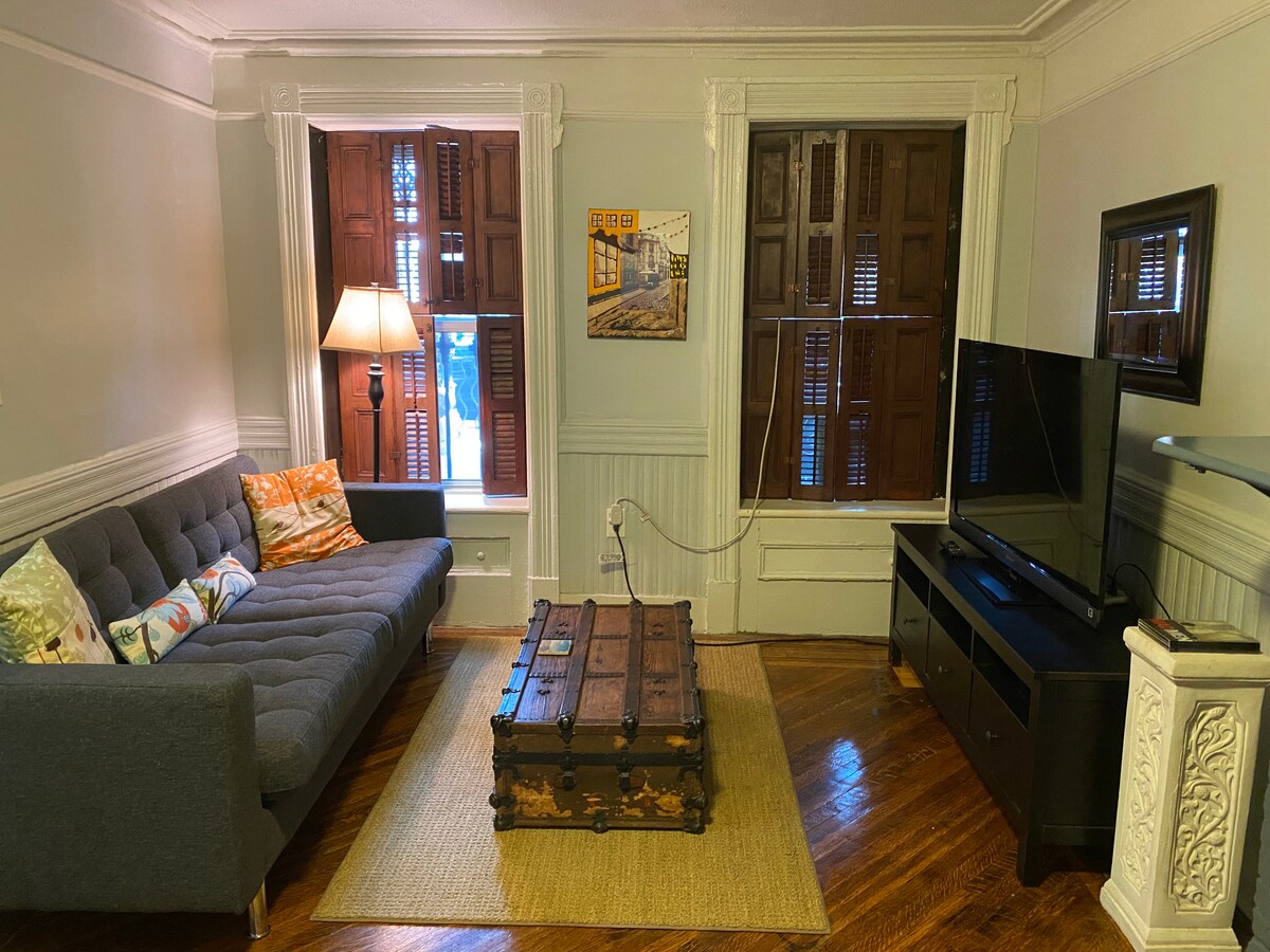 Living room couch and tv area to relax after a fun day out in the city.