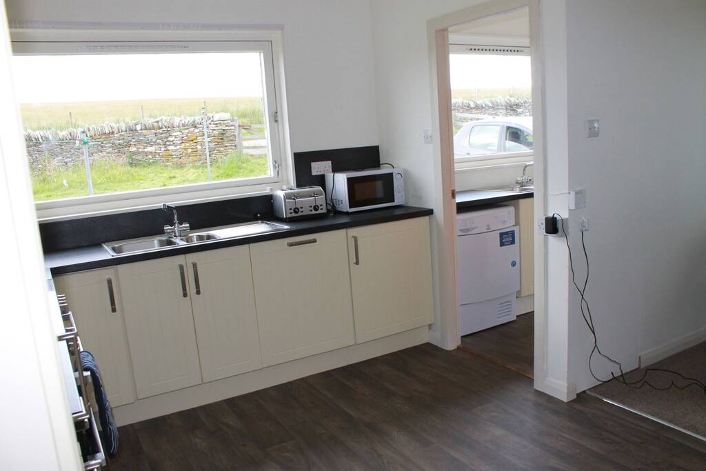 Kitchen and utility room off to the right