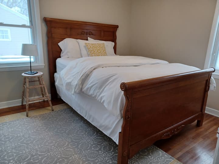 Our queen room boasts the best cotton sheets in the house, a down comforter, and a closet with a luggage rack. 