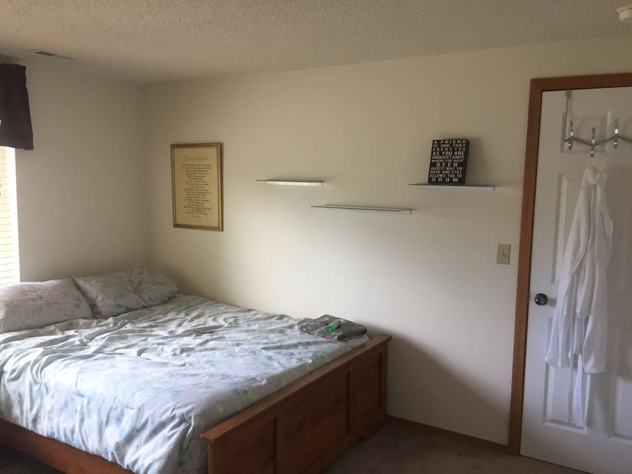 Large bedroom with queen size bed.