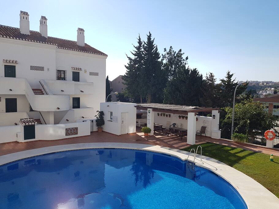View over community area. Two pools and BBQ area.