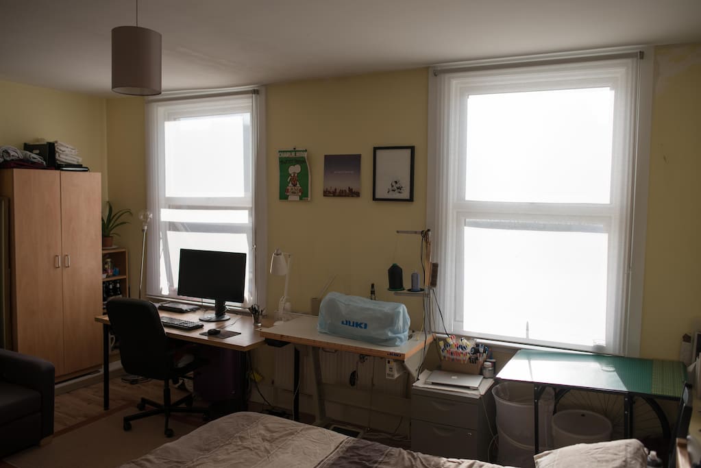 View from the bed to the window with a view of my baby (sewing machine).