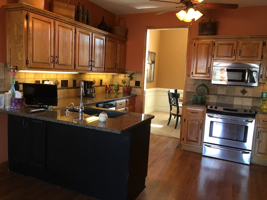 Kitchen with small television.