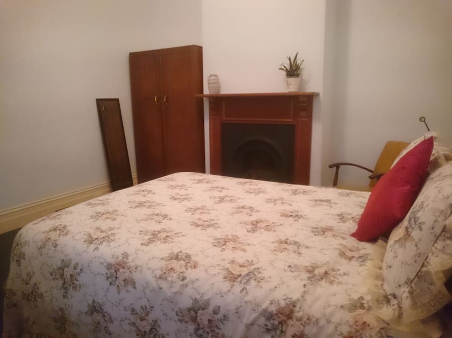 wardrobe with hangers, movable mirror, small table and a chair for your personal comfort.