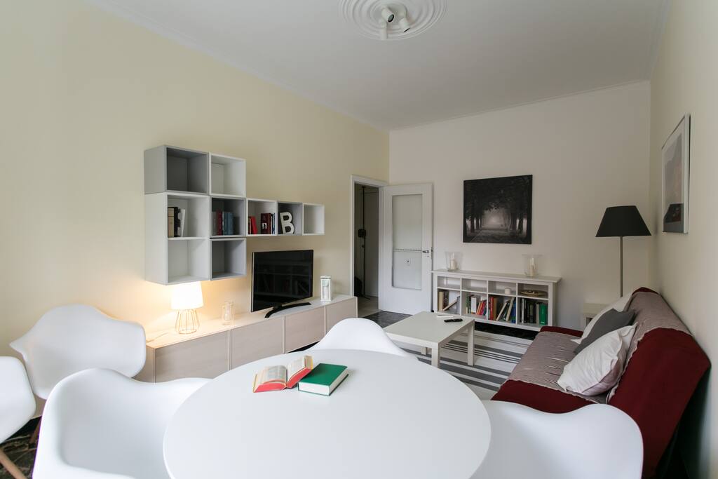 The living room with sofa bed x2, dining table & TV