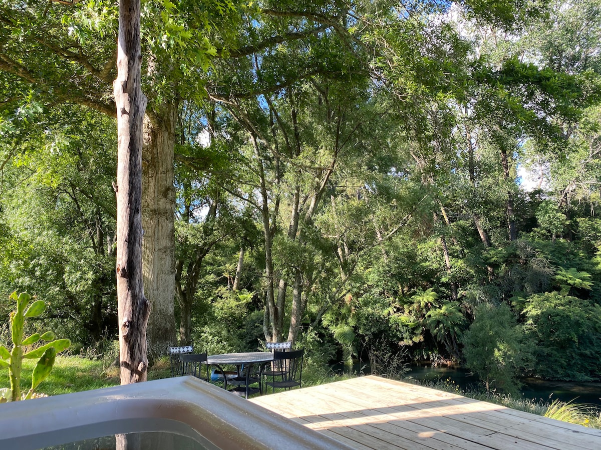 Tranquil bath view at Lone Oak Eco Cabin in Okoroire