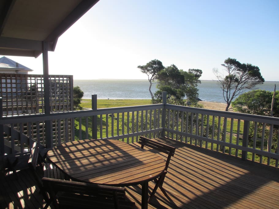 The deck, with barbeque and outdoor setting