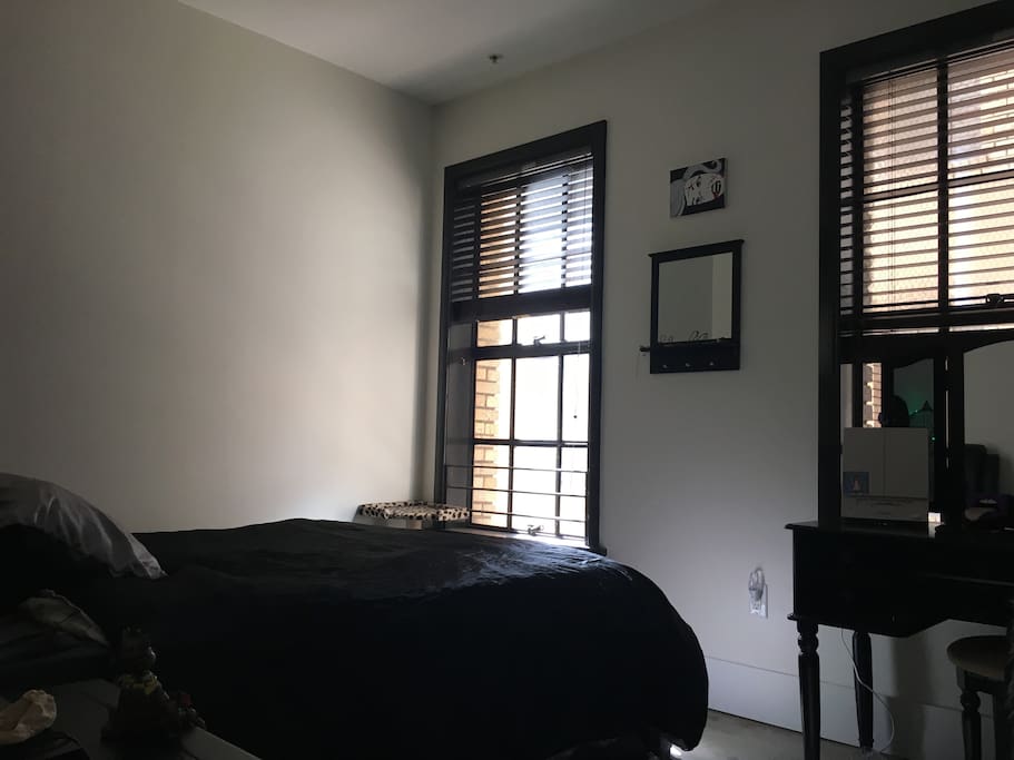 Separate bedroom in back of loft with door