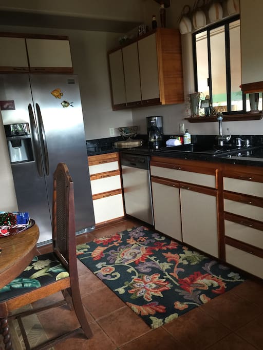 Large refrigerator and dishwasher, dining table