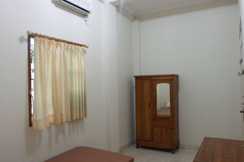 The room facility with bed, working table and the bath room :)