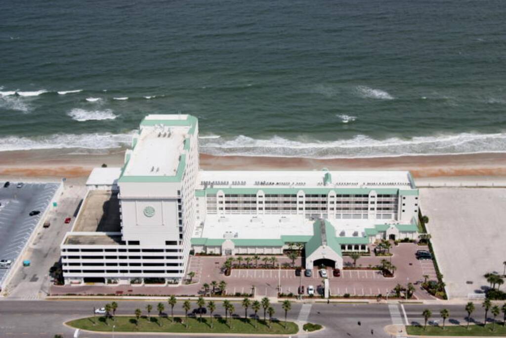 Overhead view including tower and 5-story parking garage